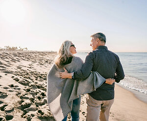 Home. Couple walk beach